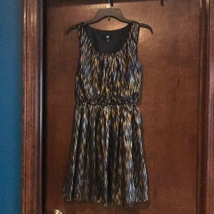 Black, silver, and gold mini dress